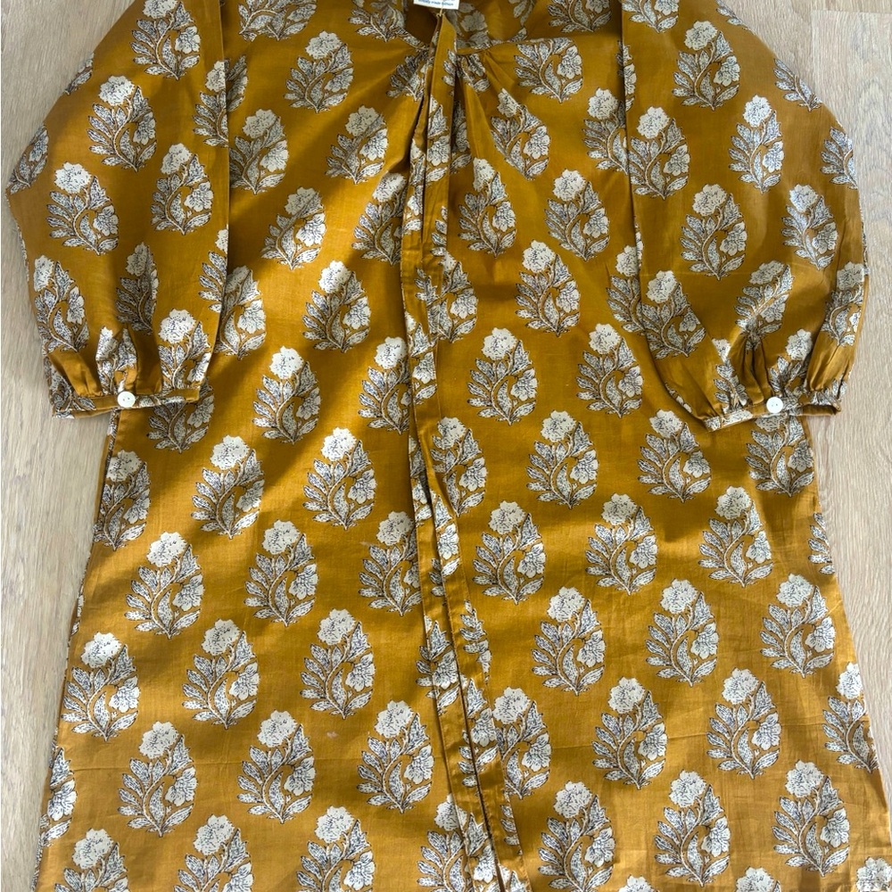 organic cotton dress. Tie belt. Block printed . Side pockets . Never worn .